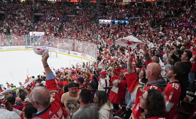 FILE - Florida Panthers fans wave towels during the third period in Game 3 of the NHL hockey Stanley Cup Eastern Conference finals against the Carolina Hurricanes Saturday, May 24, 2025, in Sunrise, Fla. (AP Photo/Lynne Sladky, File)