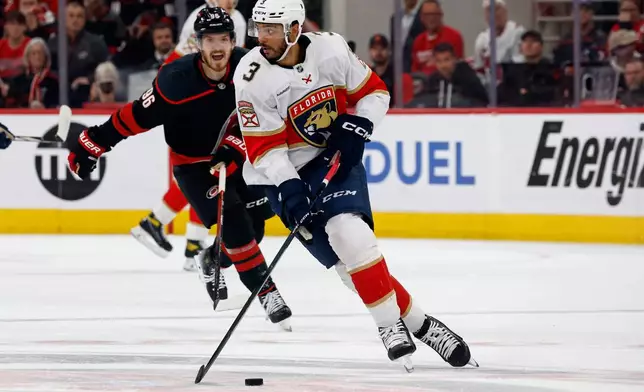 FILE - Florida Panthers' Seth Jones (3) skates against the Carolina Hurricanes during the first period of Game 1 of the NHL hockey Stanley Cup Eastern Conference finals in Raleigh, N.C., Tuesday, May 20, 2025. (AP Photo/Karl DeBlaker)