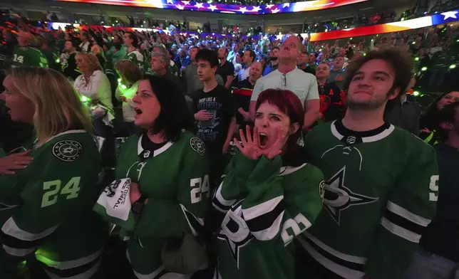 Dallas Stars fans cheer during the first period of Game 5 of the Western Conference finals in the NHL hockey Stanley Cup playoffs against the Edmonton Oilers, Thursday, May 29, 2025, in Dallas. (AP Photo/Julio Cortez)