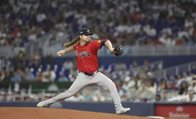 Atlanta Braves starting pitcher Grant Holmes throws during the first inning of a baseball game against the Miami Marlins, Saturday, June 21, 2025, in Miami. (AP Photo/Alexandra Rodriguez)