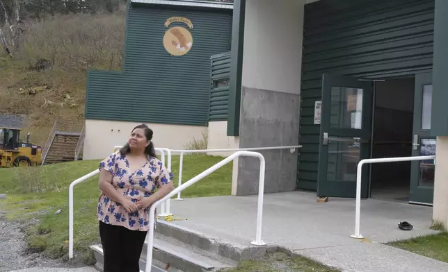 Tupe Smith poses for a photo outside the school in Whittier, Alaska, May 13, 2025. She was elected to the school board in 2023 but a week later was told she could not serve because as a native of American Samoa, she is a U.S. national but not a U.S. citizen. (AP Photo/Mark Thiessen)