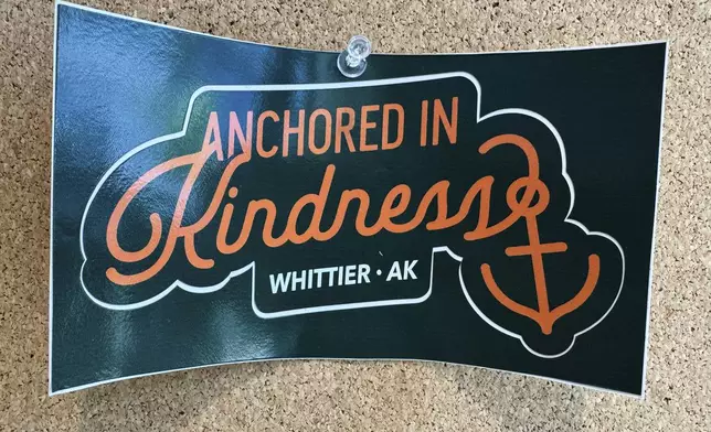 A poster with the slogan "Anchored in Kindness, Whittier, AK" is displayed in the city building in Whittier, Alaska, May 13, 2025. (AP Photo/Mark Thiessen)