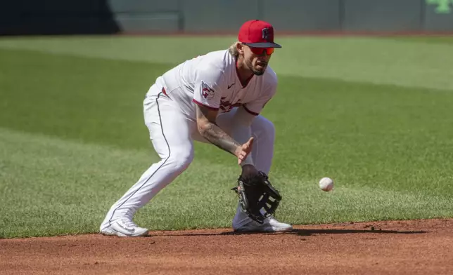Cleveland Guardians' Gabriel Arias prepares to field a ground ball by St. Louis Cardinals' Nolan Arenado during the first inning of a baseball game, Saturday, June 28, 2025, in Cleveland. (AP Photo/Phil Long)