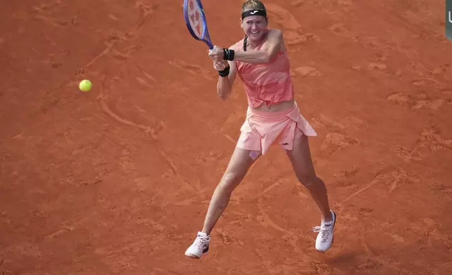 Marie Bouzkova of the Czech Republic returns the ball to Coco Gauff of the U.S. during their third round match of the French Tennis Open, at the Roland-Garros stadium, in Paris, Saturday, May 31, 2025. (AP Photo/Christophe Ena)