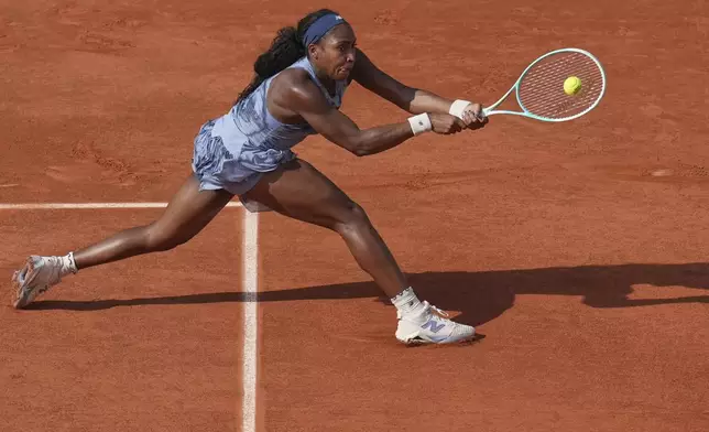 Coco Gauff of the U.S. returns the ball to Marie Bouzkova of the Czech Republic during their third round match of the French Tennis Open, at the Roland-Garros stadium, in Paris, Saturday, May 31, 2025. (AP Photo/Christophe Ena)