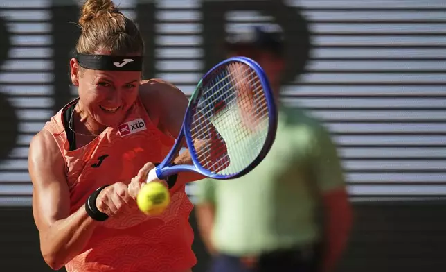 Marie Bouzkova of the Czech Republic returns the ball to Coco Gauff of the U.S. during their third round match of the French Tennis Open, at the Roland-Garros stadium, in Paris, Saturday, May 31, 2025. (AP Photo/Christophe Ena)