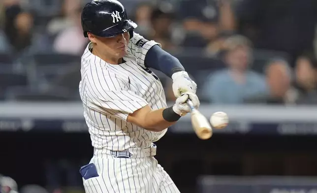 New York Yankees' Jazz Chisholm Jr. celebrates with teammates after hitting a home run during the seventh inning of a baseball game against the Cleveland Guardians, Tuesday, June 3, 2025, in New York. (AP Photo/Frank Franklin II)