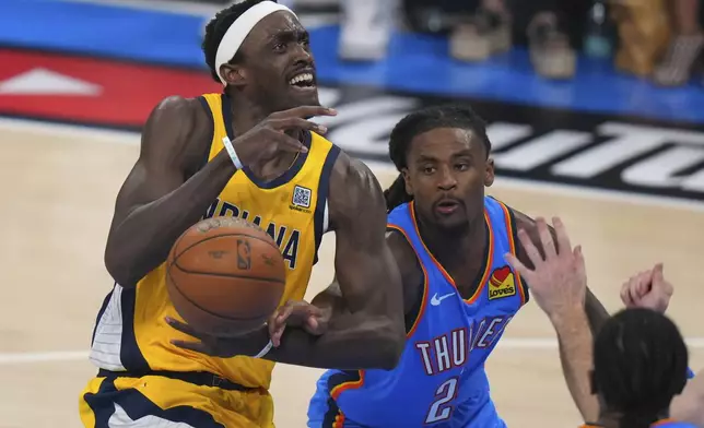 Oklahoma City Thunder guard Cason Wallace, right, fouls Indiana Pacers forward Pascal Siakam during the first half of Game 7 of the NBA Finals basketball series Sunday, June 22, 2025, in Oklahoma City. (AP Photo/Nate Billings)