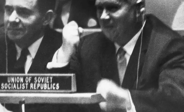 FILE - Soviet Premier Nikita Khrushchev pounds his desk with his fist at the United Nations, Oct. 12, 1960, during angry debate, as his wrist watch is on the desk in front of him. (AP Photo, File)