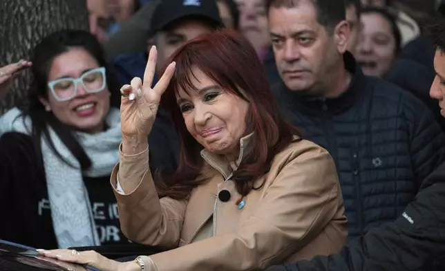 Argentina's former President Cristina Fernandez greets supporters as she leaves her home in Buenos Aires, Argentina, Tuesday, June 10, 2025. (AP Photo/Rodrigo Abd)