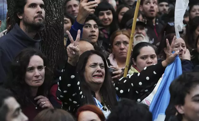 Supporters of former President Cristina Fernandez react after Argentina's Supreme Court upheld her corruption conviction, outside the Peronist Party headquarters in Buenos Aires, Argentina, Tuesday, June 10, 2025. (AP Photo/Rodrigo Abd)
