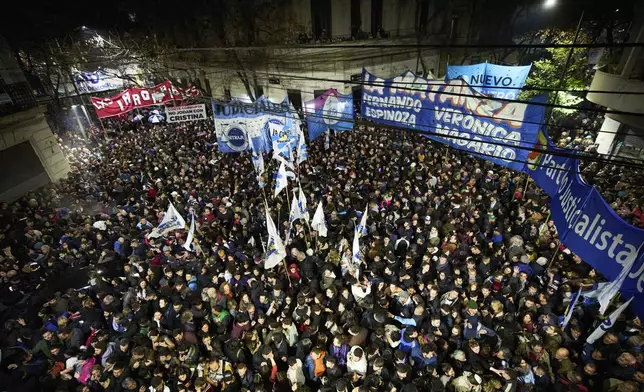 Supporters of former President Cristina Fernandez gather in front of her home after Argentina's Supreme Court upheld her corruption conviction, in Buenos Aires, Argentina, Tuesday, June 10, 2025. (AP Photo/Rodrigo Abd)