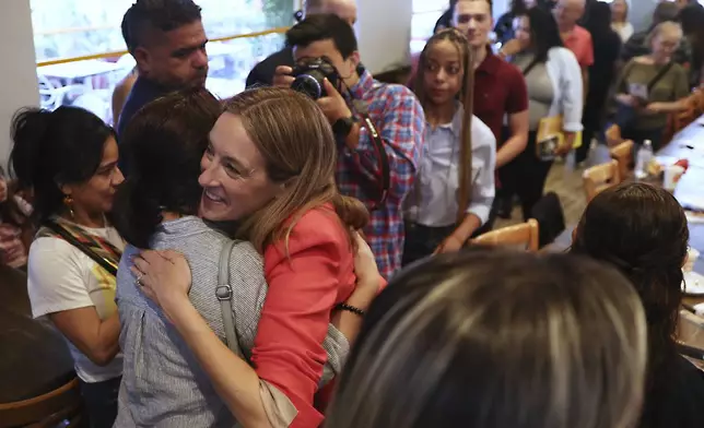 Rep. Mikie Sherrill, D-N.J., greets people during a "Get Out the Vote" rally, Saturday, June 7, 2025, in Elizabeth, N.J. (AP Photo/Heather Khalifa)
