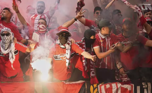Wydad supporters light torches during the Club World Cup Group G soccer match between Juventus and Wydad AC in Philadelphia, Sunday, June 22, 2025. (AP Photo/Chris Szagola)