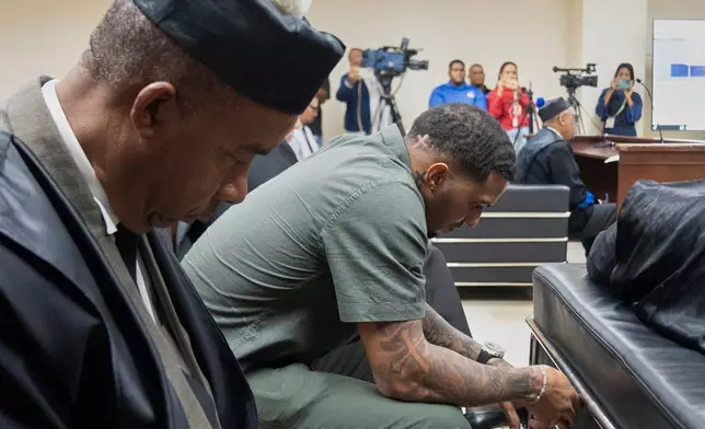 Tampa Bay Rays shortstop Wander Franco, right, reacts during his trial on charges of sexual abuse of a minor, in Puerto Plata, Dominican Republic, Thursday, June 26, 2025. (AP Photo/Fran Afonso)