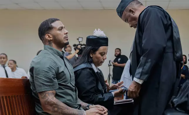 Tampa Bay Rays shortstop Wander Franco, left, reacts during his trial on charges of sexual abuse of a minor, in Puerto Plata, Dominican Republic, Thursday, June 26, 2025. (AP Photo/Fran Afonso)