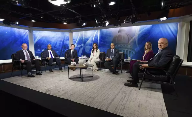FILE - From left, New Jersey Rep. Josh Gottheimer; Newark Mayor Ras Baraka; Jersey City Mayor Steve Fulop; moderator NJ Spotlight News anchor Briana Vannozzi; moderator WNYC Morning Edition host Michael Hill; New Jersey Rep. Mikie Sherrill; and former state Senate President Steve Sweeney attend the New Jersey Democratic gubernatorial primary debate Monday, May 12, 2025, in Newark, N.J. (Steve Hockstein/NJ Advance Media via AP, Pool, File)