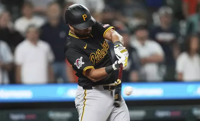 Pittsburgh Pirates' Isiah Kiner-Falefa hits a two-run single against the Detroit Tigers in the 10th inning during the second baseball game of a doubleheader, Thursday, June 19, 2025, in Detroit. (AP Photo/Paul Sancya)