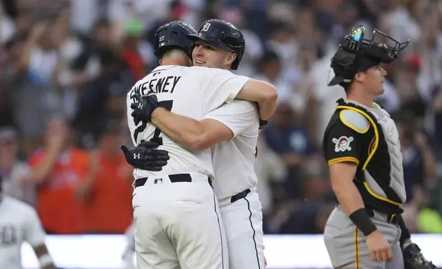 Detroit Tigers' Colt Keith, right, celebrates his two-run home run with Trey Sweeney against the Pittsburgh Pirates in the seventh inning during the second baseball game of a doubleheader, Thursday, June 19, 2025, in Detroit. (AP Photo/Paul Sancya)