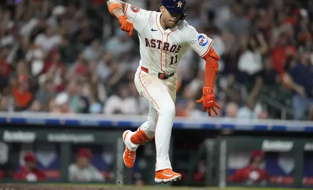 Houston Astros' Cam Smith reacts as his RBI single scores the go-ahead run against the Philadelphia Phillies during the eighth inning of a baseball game, Thursday, June 26, 2025, in Houston. (AP Photo/Karen Warren)