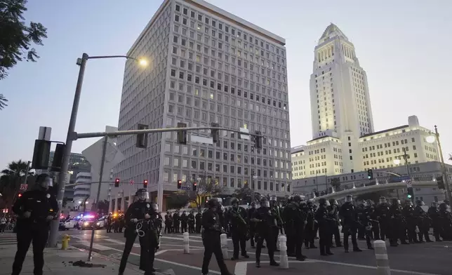 Police block a street during a protest on Tuesday, June 10, 2025, in Los Angeles. (AP Photo/Eric Thayer)