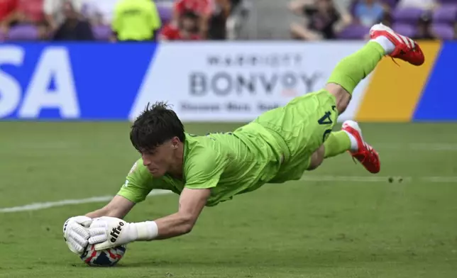 Auckland City's Nathan Garrow makes a save during the Club World Cup Group C soccer match between Benfica and Auckland City in Orlando, Fla., Friday, June 20, 2025. (AP Photo/Phelan Ebenhack)