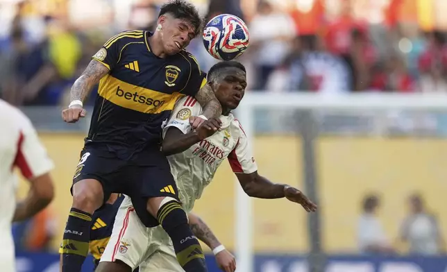 Benfica's Florentino Luis, right, and Boca Juniors' Carlos Palacios go for a header during the Club World Cup group C soccer match between Boca Juniors and Benfica in Miami Gardens, Fla., Monday, June 16, 2025. (AP Photo/Rebecca Blackwell)