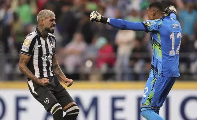 Botafogo goalie John, right, and Alexander Barboza celebrate their win during the Club World Cup group B soccer match between Botafogo and Seattle Sounders at Seattle Lumen Field, in Seattle, Sunday, June 15, 2025. (AP Photo/Ryan Sun)