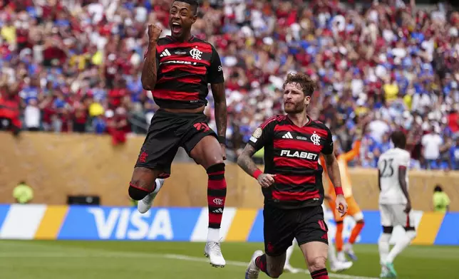 Flamengo's Bruno Henrique, left, celebrates after scoring during the Club World Cup Group D soccer match between Flamengo and Chelsea in Philadelphia, Friday, June 20, 2025. (AP Photo/Derik Hamilton)