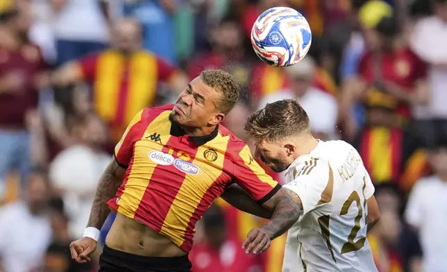 Esperance de Tunis' Yan Sasse, left, and Los Angeles FC's Ryan Hollingshead battle for the ball during the Club World Cup Group D soccer match between Los Angeles FC and ES Tunisie in Nashville, Tenn., Friday, June 20, 2025. (AP Photo/George Walker IV)