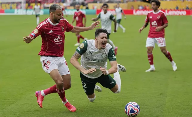 Al Ahly's Ahmed Ramadan fouls Palmeiras' Joaquin Piquerez during the Club World Cup group A soccer match between Palmeiras and Al Ahly in East Rutherford, N.J., Thursday, June 19, 2025. (AP Photo/Seth Wenig)