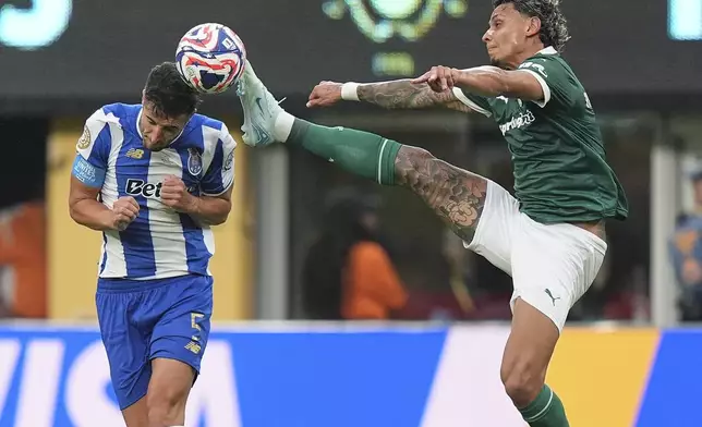 Palmeiras' Richard Rios, right, and Porto's Ivan Marcano vie for the ball during the second half of a Club World Cup group A soccer match, Sunday, June 15, 2025, in East Rutherford, N.J. (AP Photo/Frank Franklin II)