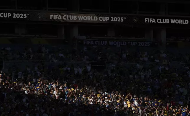 Soccer fans attend the Club World Cup group C soccer match between Boca Juniors and Benfica in Miami Gardens, Fla., Monday, June 16, 2025. (AP Photo/Rebecca Blackwell)
