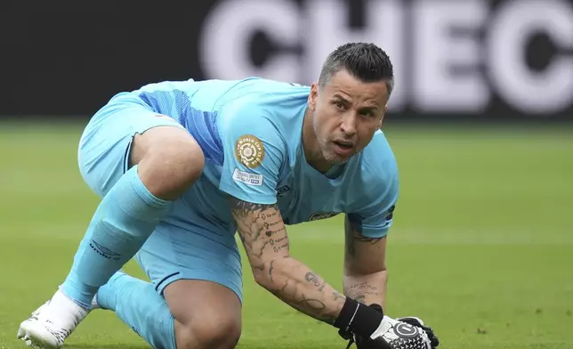Fluminense's goalkeeper Fabio sits on the pitch during the Club World Cup group F soccer match between Fluminense and Borussia Dortmund in East Rutherford, N.J., Tuesday, June 17, 2025. (AP Photo/Frank Franklin II)