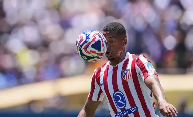 Atletico Madrid's Samuel Lino eyes the ball during the Club World Cup group B soccer match between PSG and Atletico Madrid, in Pasadena, Calif., Sunday, June 15, 2025. (AP Photo/Mark J. Terrill)
