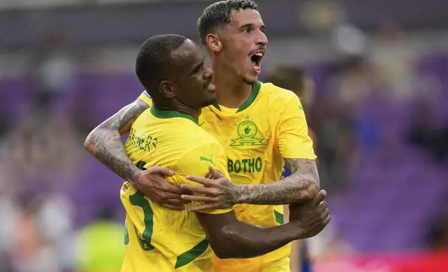 Mamelodi Sundowns' Iqraam Rayners celebrates after scoring the opening goal with Mamelodi Sundowns' Arthur Sales during the Club World Cup group F soccer match between Ulsan HD and Mamelodi Sundowns in Orlando, Tuesday, June 17, 2025. (AP Photo/John Raoux)