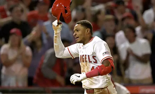 Los Angeles Angels' Christian Moore celebrates after hitting a walk-off two-run home run in the 10th inning of a baseball game against the Boston Red Sox, Tuesday, June 24, 2025, in Anaheim, Calif. (AP Photo/Jayne Kamin-Oncea)