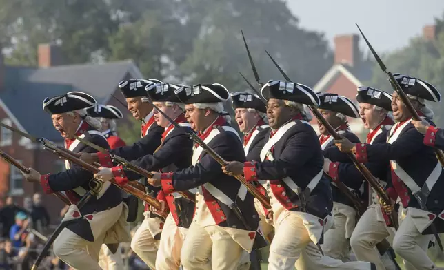 U.S. Army soldiers hold a performance as Washington's Continental Army during the Army Birthday Twilight Tattoo event at Joint Base Myer-Henderson Hall, Wednesday, June 11, 2025, in Fort Myer, Va. (AP Photo/Rod Lamkey, Jr.)