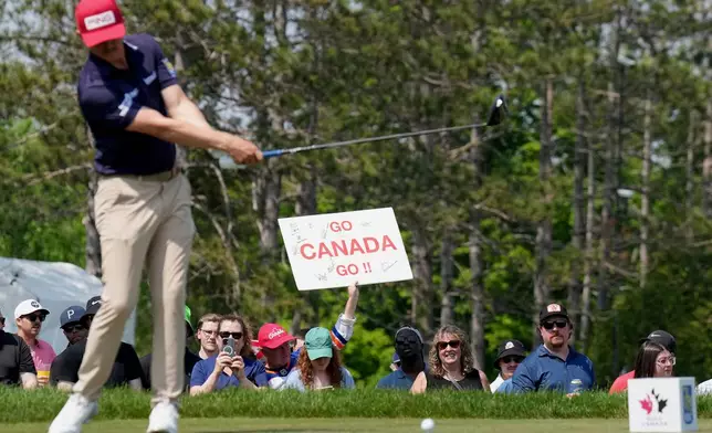 Canadian fans cheer on their national players as Mackenzie Hughes tees off at the 17th hole during the third round of the Canadian Open golf tournament in Caledon, Ontario, Saturday, June 7, 2025. (Nathan Denette/The Canadian Press via AP)