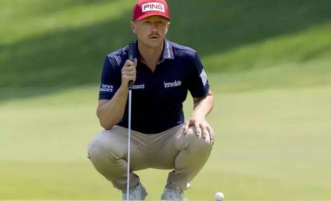 Canada's Mackenzie Hughes lines up his putt on the 10th hole during the third round of the Canadian Open golf tournament in Caledon, Ontario, Saturday, June 7, 2025. (Frank Gunn/The Canadian Press via AP)
