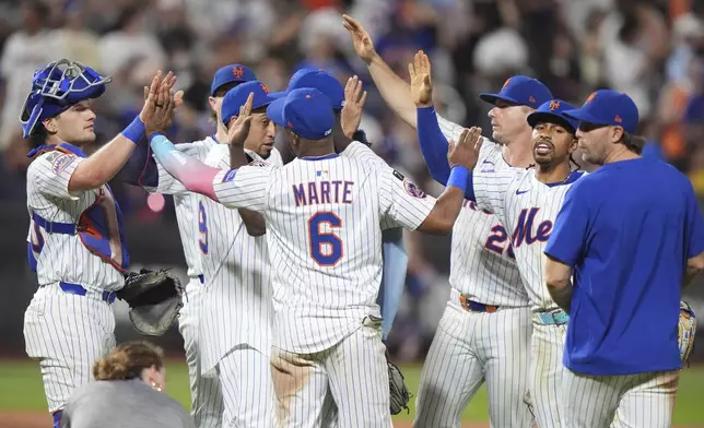 The New York Mets celebrate after a baseball game against the Atlanta Braves Wednesday, June 25, 2025, in New York. (AP Photo/Frank Franklin II)