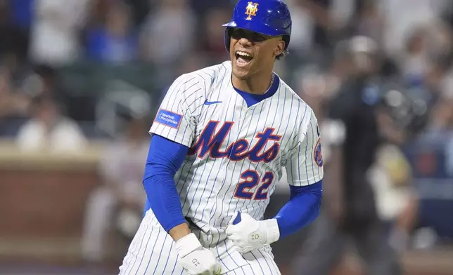 New York Mets' Juan Soto celebrates after hitting a home run during the seventh inning of a baseball game against the Atlanta Braves Wednesday, June 25, 2025, in New York. (AP Photo/Frank Franklin II)