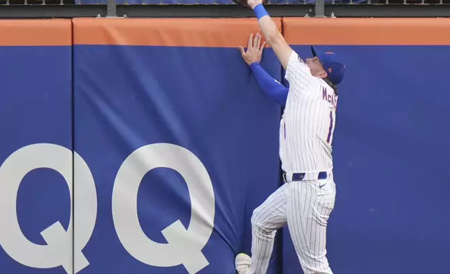 New York Mets' Jeff McNeil (1) catches a ball hit by Atlanta Braves' Marcell Ozuna for an out during the first inning of a baseball game Wednesday, June 25, 2025, in New York. (AP Photo/Frank Franklin II)