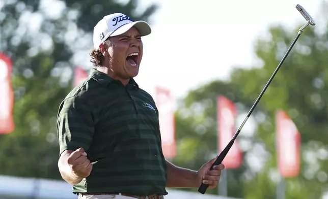 Aldrich Potgieter, of South Africa, celebrates after his winning putt in a playoff during the final round of the Rocket Classic golf tournament at Detroit Golf Club, Sunday, June 29, 2025, in Detroit. (AP Photo/Paul Sancya)