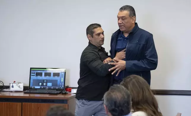U.S. Sen. Alex Padilla, D-Calif., is pushed out of the room as Homeland Security Secretary Kristi Noem holds a news conference regarding the recent protests in Los Angeles, Thursday, June 12, 2025. (David Crane/The Orange County Register via AP)
