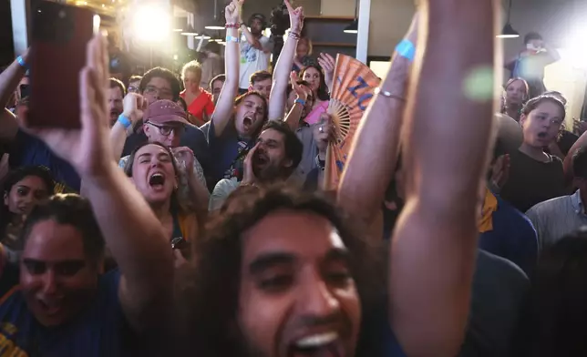 Supporters of Democratic mayoral candidate Zohran Mamdani cheer before he takes the stage at his primary election party, Wednesday, June 25, 2025, in New York. (AP Photo/Heather Khalifa)