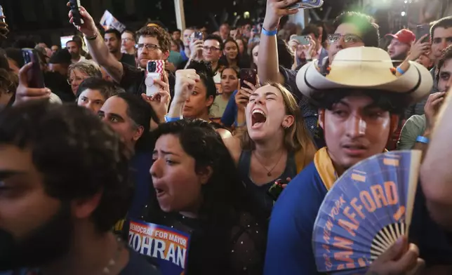Supporters of Democratic mayoral candidate Zohran Mamdani cheer while he speaks at his primary election party, Wednesday, June 25, 2025, in New York. (AP Photo/Heather Khalifa)