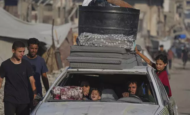 Displaced Palestinians flee Jabalia after the Israeli army issued evacuation orders, in Gaza City, Sunday, June 29, 2025. (AP Photo/Jehad Alshrafi)