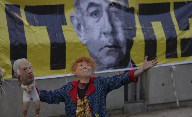 People take part in a protest demanding the end of the war and immediate release of hostages held by Hamas in the Gaza Strip, and against Prime Minister Benjamin Netanyahu's government in Tel Aviv, Israel, Saturday, June 28, 2025. (AP Photo/Ariel Schalit)