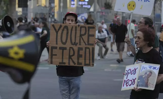People take part in a protest demanding the end of the war and immediate release of hostages held by Hamas in the Gaza Strip, and against Prime Minister Benjamin Netanyahu's government in Tel Aviv, Israel, Saturday, June 28, 2025. (AP Photo/Ariel Schalit)